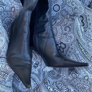 Ladies BLack leather pointy toe boots.  Heel is approximately 3 1/2 inches high
